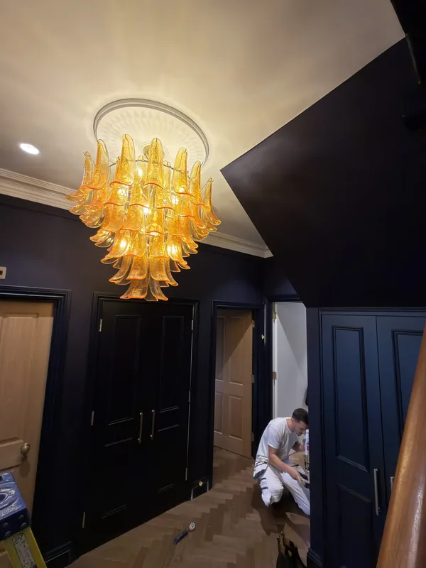 Entrance hall: Amber glass chandelier and downlights
