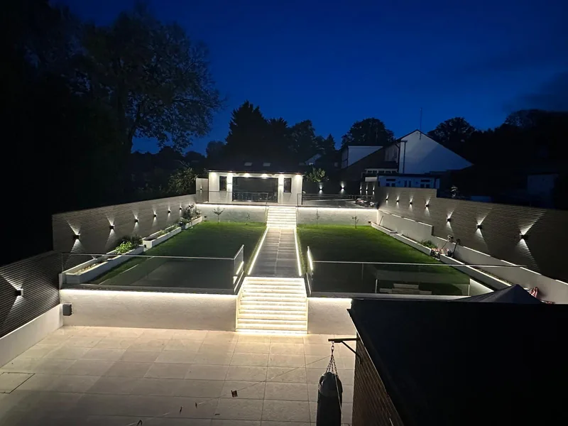 Garden: Garden lighting at dusk, from the terrace to the far wall
