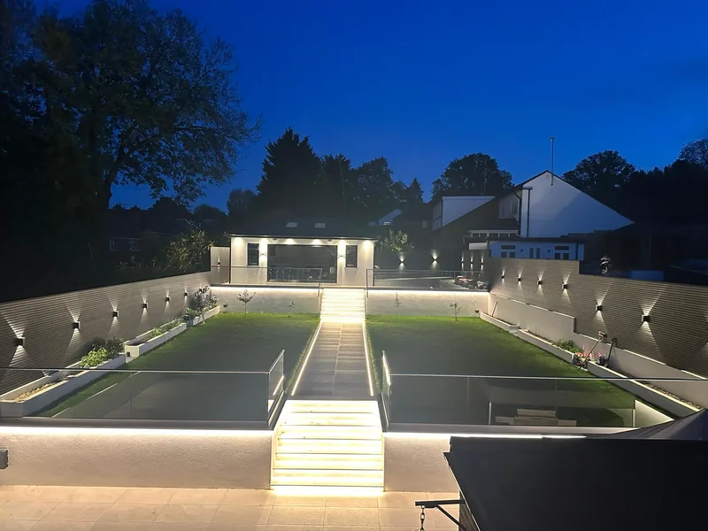 Garden: Lit steps, wall lights and LED strips along the lawn edges