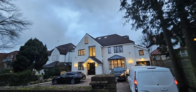 House front: Outdoor and porch lighting at dusk
