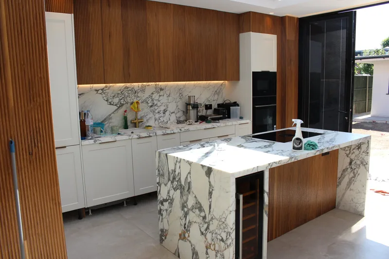 Kitchen: Downlights and LED lighting under walnut cabinets