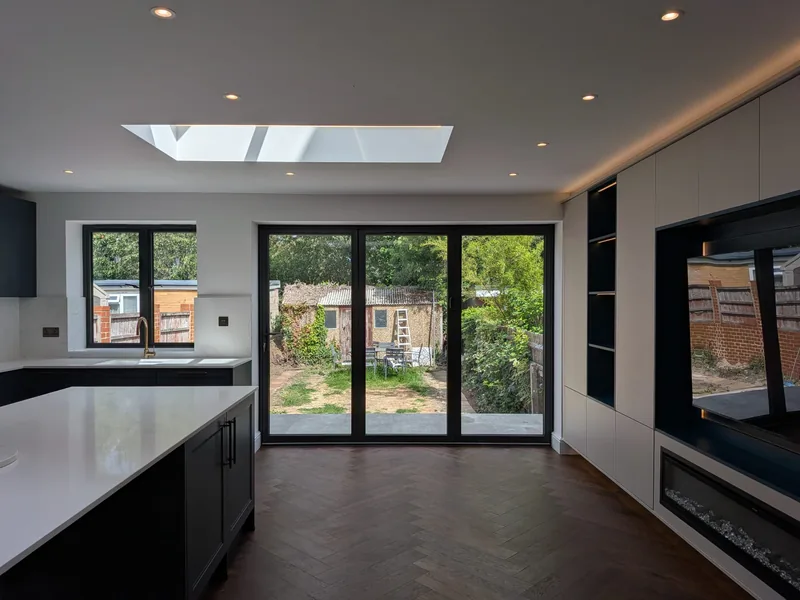 Kitchen extension: Downlights and LED-lit rooflights over an open-plan kitchen
