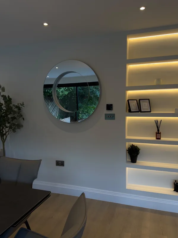 Living room: LED-lit alcove shelving and downlights