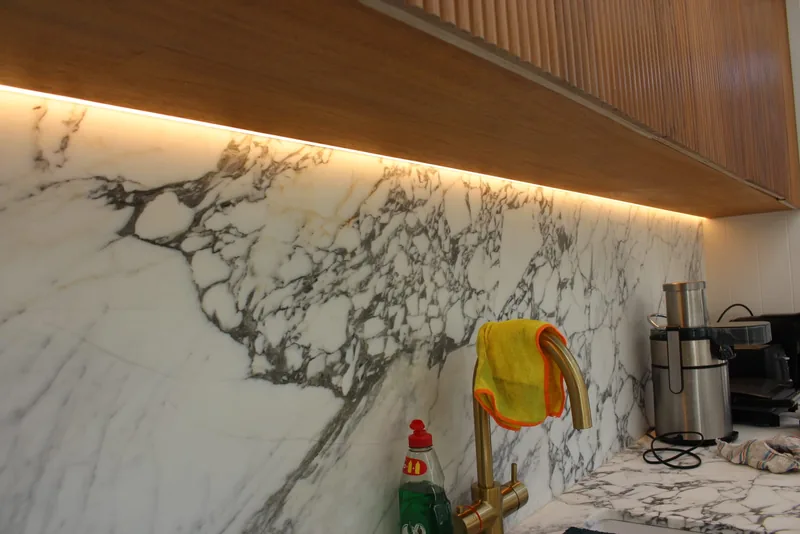 Kitchen: Concealed LED strip washing a marble splashback
