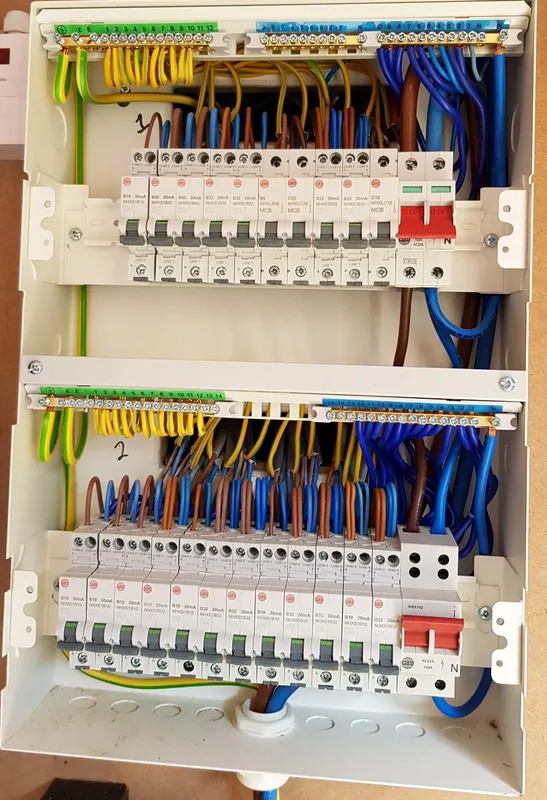 Two new consumer units, neatly wired and labelled