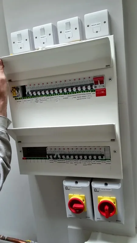 Consumer units with surge protection and two red rotary isolators