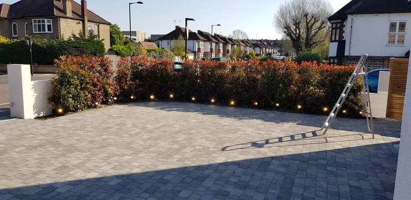 Front driveway: A row of LED deck lights set into the paving
