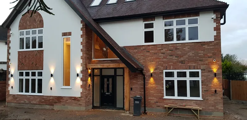 House front: Outdoor wall lights by the windows and front door