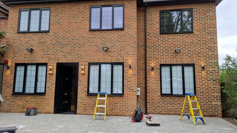 House front: Matching outdoor wall lights along the front