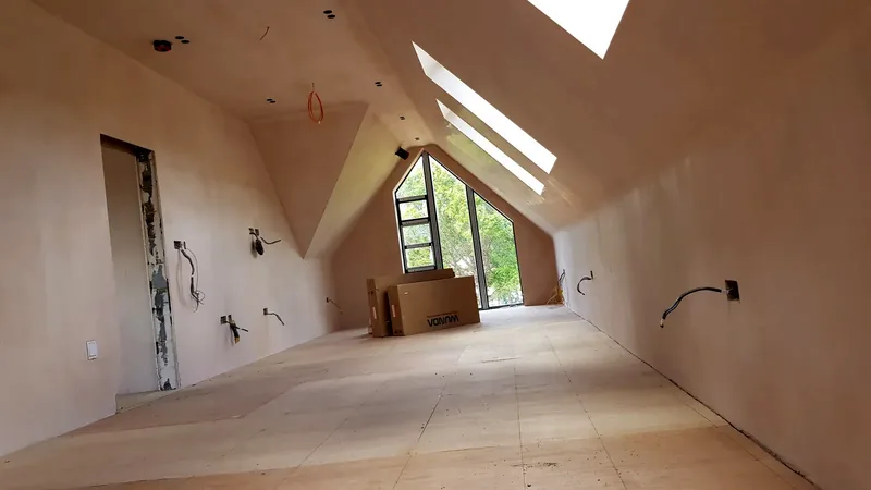 Loft conversion at first fix, with new cabling and back boxes in place
