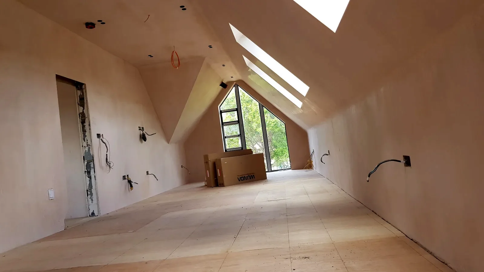 Loft conversion at first fix, with new cabling and back boxes in place
