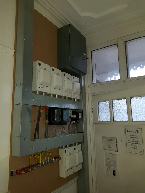 Landlord supply and meter board installation in a communal hallway