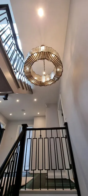 Stairwell with a large crystal chandelier